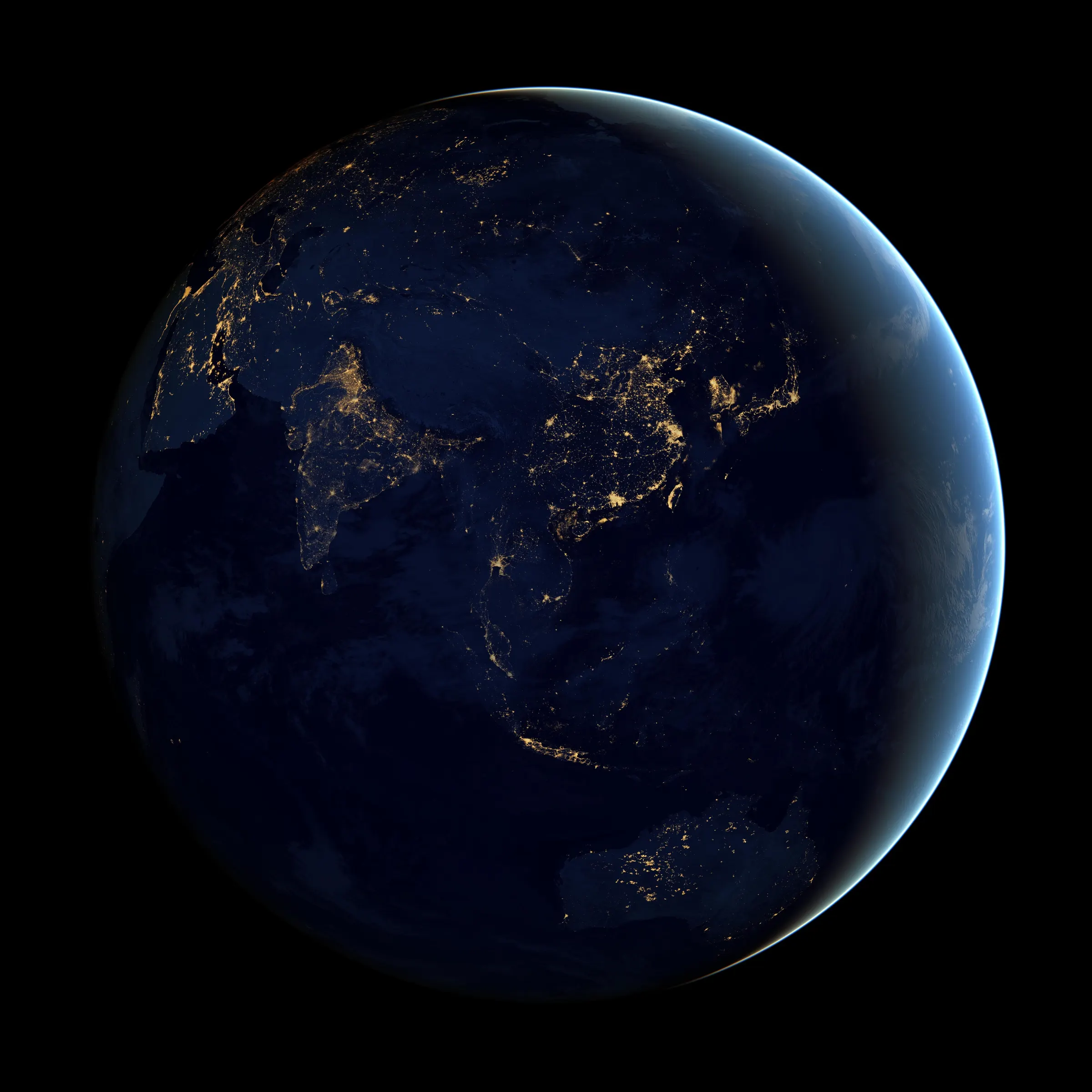 Night view of the globe centred on Asia, with the lights of India, China, Korea and Japan glowing gold